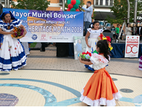 Volunteer Opportunities Young dancers in traditional dress at festival